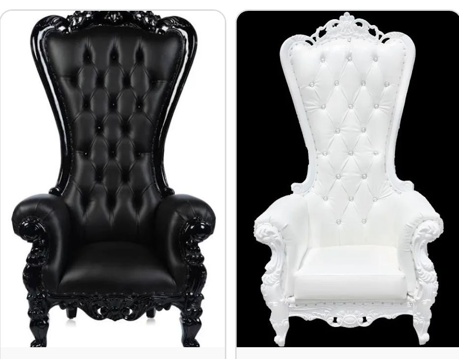 Black and white high-back tufted armchairs with ornate detailing.